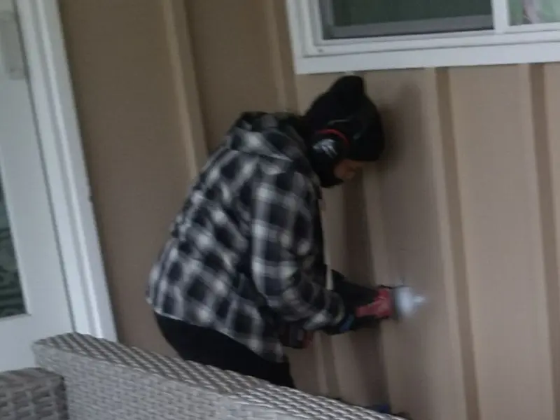 Professional electrician installing an exterior outlet in Gallup