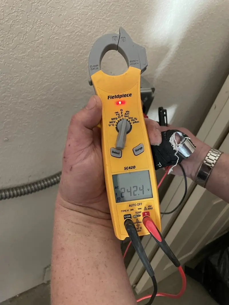 Voltage testing with clamp meter during Electrical Installation Services in Gallup
